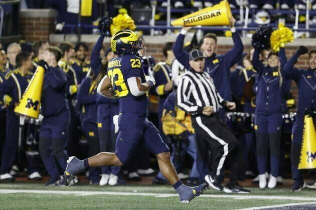 No. 18 Michigan on playoff outfield, digs in for Northwestern at Wrigley Field