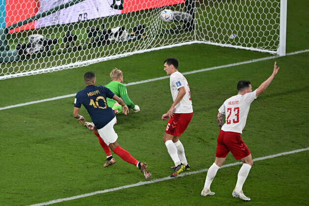 Mbappe's double sends France through