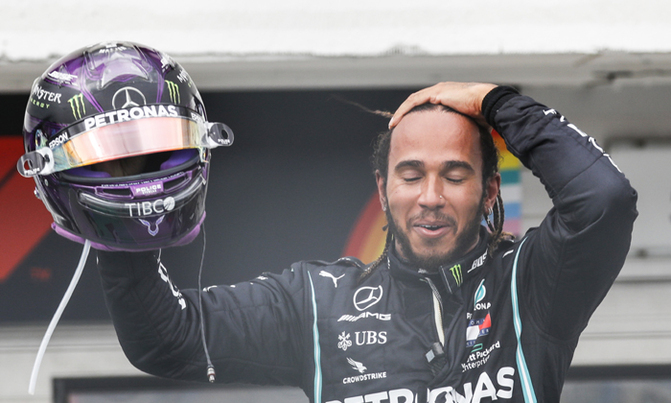 Hamilton claims record win and top spot in title race Hamilton claims record win and top spot in title race