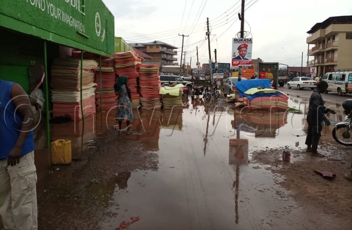 Floodwaters invaded a number of businesses. Photo by Ponsiano Nsimbi