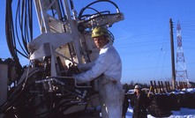  Ray Roussy with the first drill rig that he designed in 1975 to investigate the usefulness of high-frequency vibrations in the drilling industry