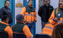 Maria de la Luz Osses speaks with her team