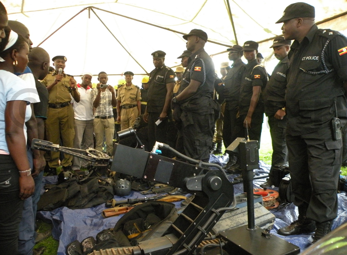 aweesi displays bomb disposal equipment during the celebration that marked 100 years of olice at ailway rounds in eptember 2014 hoto by bbey amadhan