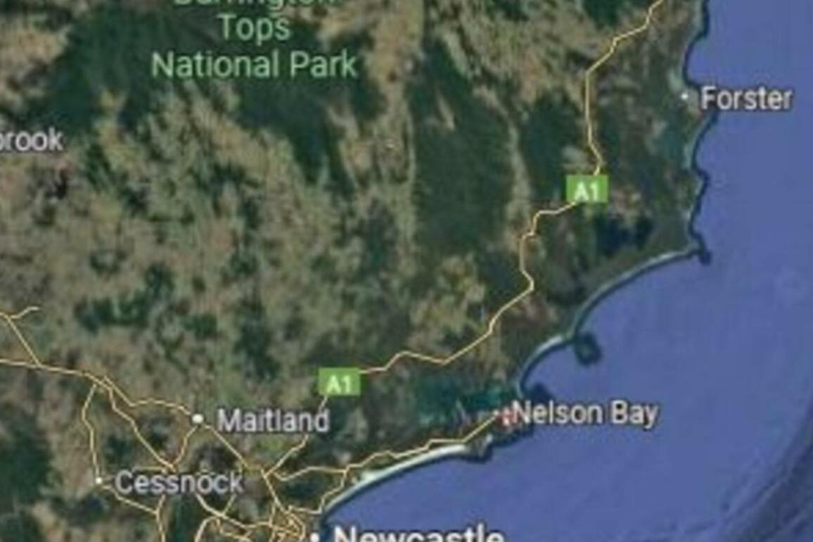 Man dies and another is critical after being pulled from the surf at a NSW beach