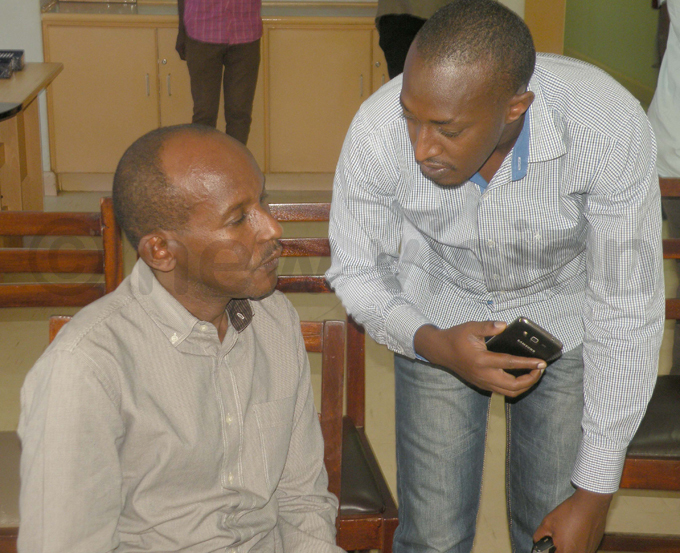 maniraguha chats with a relative after his arrest hoto by amadhan bbey