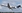 An Alliance Fokker 100 jet taking off.