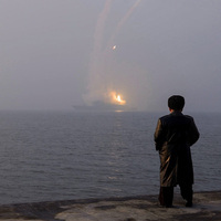 North Korea ruler Kim oversees cruise missile tests from new naval destroyer