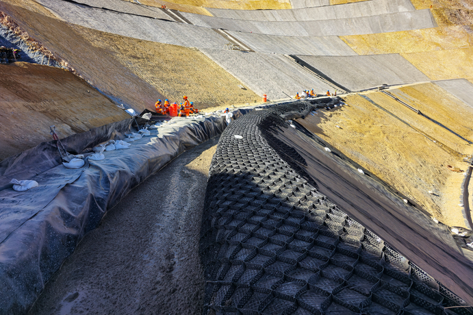 An example of slope stabilisation utilising a combination of shotcrete and geosynthetic materials