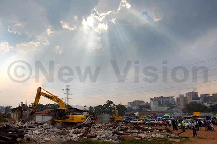  ight from the sky hitting debris at ganda ailway onstruction staff buildings demolished by  aving way for the construction of the first flyover in ampala on uly 26 2019 hoto by adru atumba 