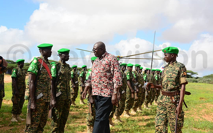 tate minister for defence ol harles kello ngola inspects a guard of honour at lbeska hoto by ddie sejjoba