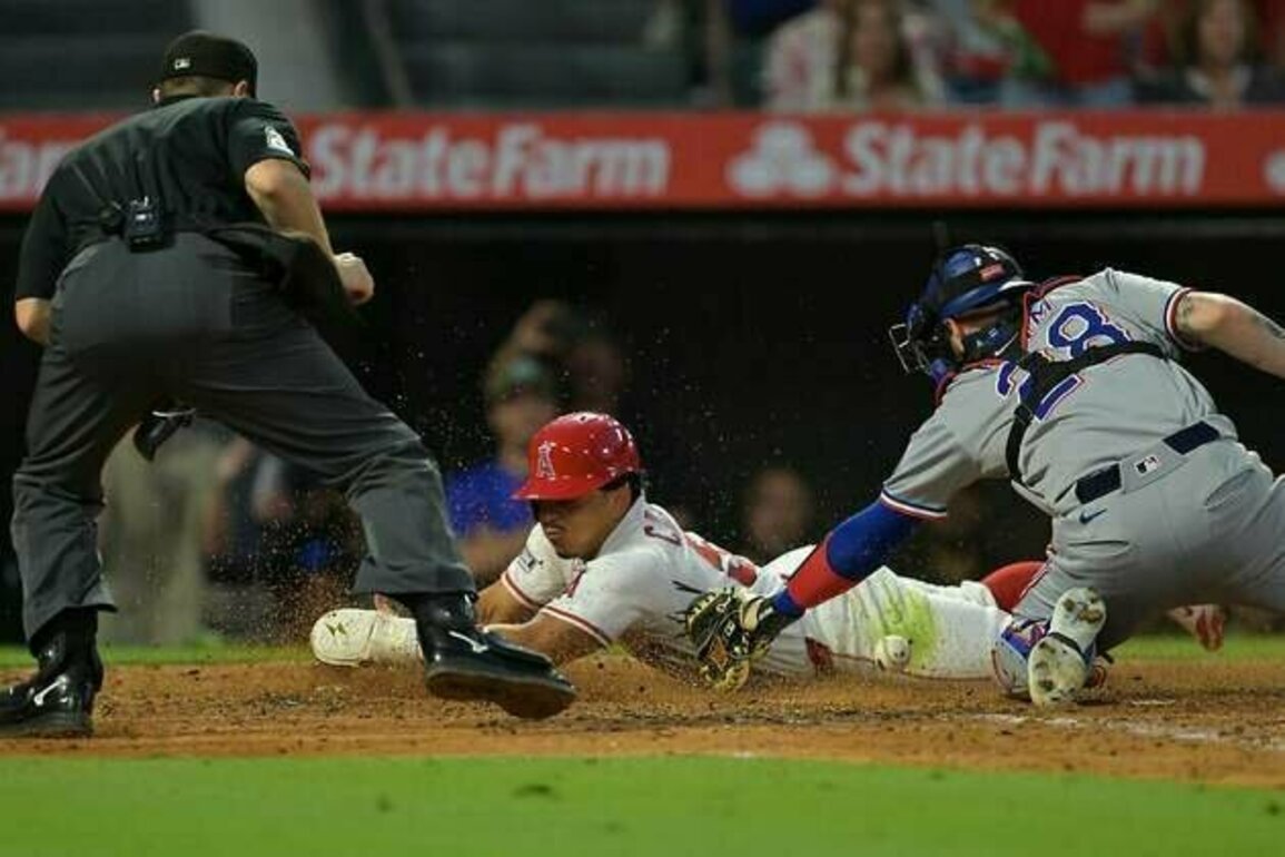 Angels bash three homers, end Rangers' winning streak