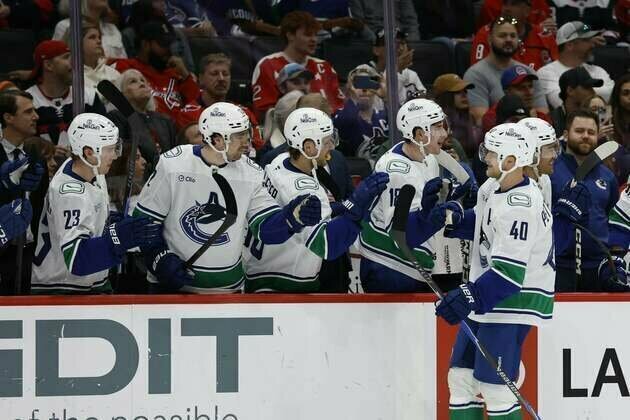 Short-handed Canucks survive Capitals' furious rally