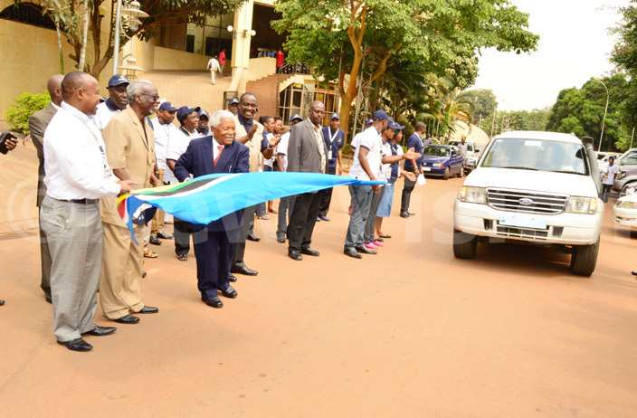  ormer anzanian presidents li assan winyi flags off the ast frican ommunity election observer mission to ganda on ebruary 12 2016 at mperial oyale otel in ampala 