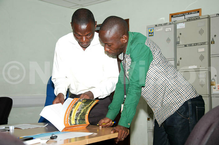  akasa editor ebidde iryowa  consults with one of the judges ivumbi