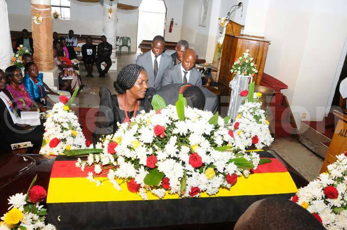  bel hairas parents lay a wreath on their sons casket t was so painful to take in hairas father stayed longer at the coffin as reality sank in that his son was gone