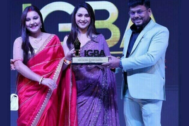 Tapas Biswas (Founder Leader Of Renatus Wellness) and Wife Angita Biswas Receive Award from Actress Madhuri Dixit at Indo Global Business Awards