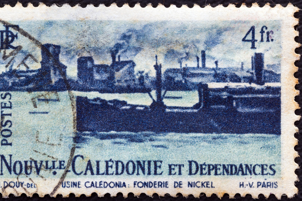 NEW CALEDONIA - CIRCA 1948: A stamp printed in France shows Nickel foundry and ship.