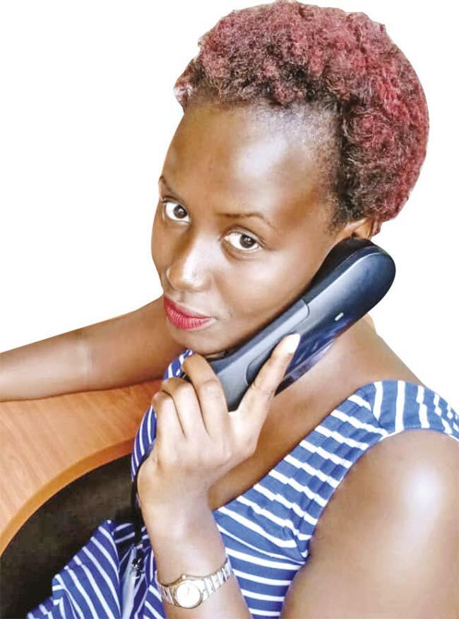  loria atukunda at her workstation in the call centre