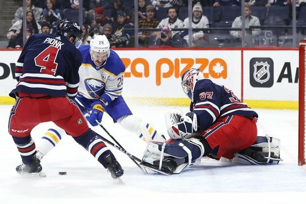 Connor Hellebuyck stops 26 shots as Jets edge Sabres