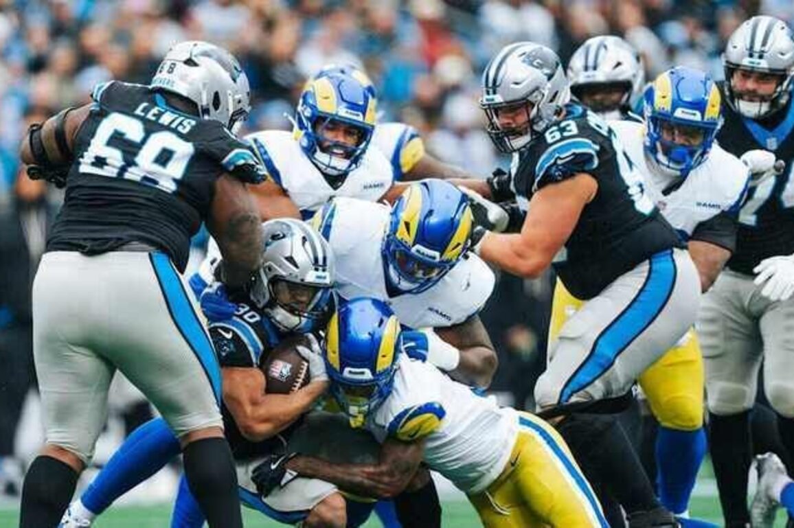 Offensive linemen live out their dream, pacing a big win in the rain
