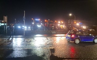 Farmers hand out flyers to public at protest outside Antrim Tesco