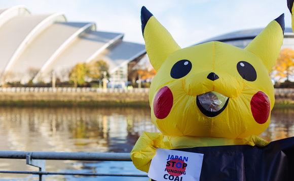 Activists dressed as Pikachu protest against Japan's coal industry outside COP26