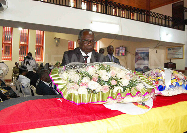  inister of ublic ervice uruli ukasa lays a wreath at the casket of the late ary uwum