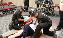 A team tackles the first aid challenge at the 2013 event