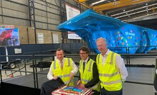  L-R: WA premier Mark McGowan, Rio Tinto Iron Ore CEO Simon Trott and Austin Engineering CEO David Singleton cut a cake in front of the new ULTIMA truck body