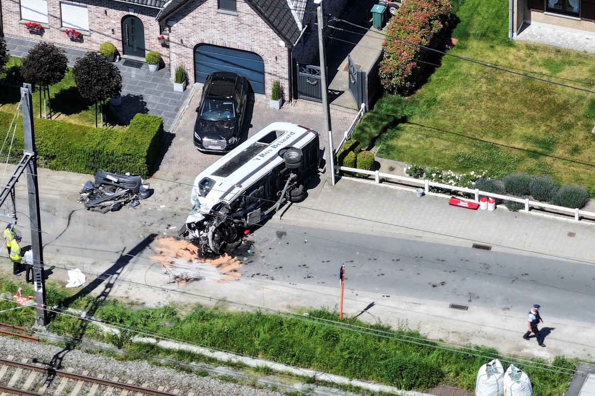 Four killed after Belgian school minibus hit by train at level crossing