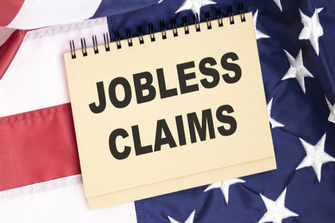 Jobless claims surge as corporate profits slump in first quarter