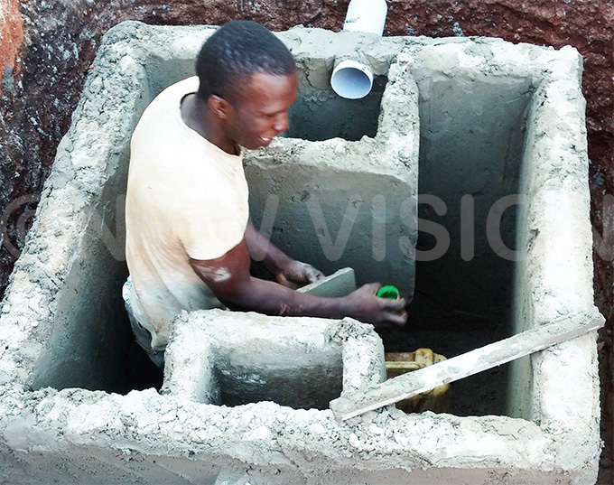   man constructs a bio digester septic tank