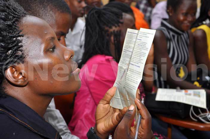  akerere niversity student reads information on emergency contraception during a campaign dubbed ot 2 ate the sooner the better the right way at campus on ednesday arch 16 2016 hoto by rancis morut
