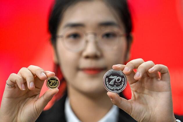 China's central bank issues commemorative coins for Xinjiang Uygur Autonomous Region 70th anniversary