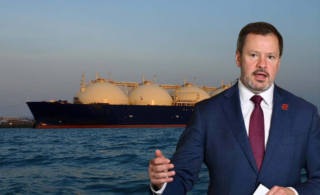Labor minister calls for gas export restrictions. Pictured Labor frontbencher Ed Husic in front of an Australia LNG export tanker.