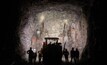  Miners operating a jumbo drill at the face of a high-grade development drift near the centre of the Kakula Mine