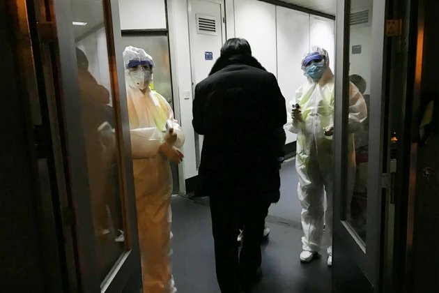 China Building a Hospital to Treat Virus, Expands Lockdowns