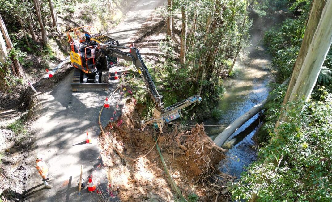 A Lumesa LDA 91 drilling attachment mounted on a Volvo excavator providing a slope stabilisation solution in Australia