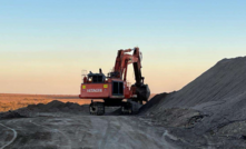 The recently mobilised 120t excavator working on the northern berm of heap leach pad.
