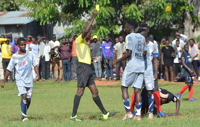 iweewa dishes out a yellow card to a t awrence player during the match