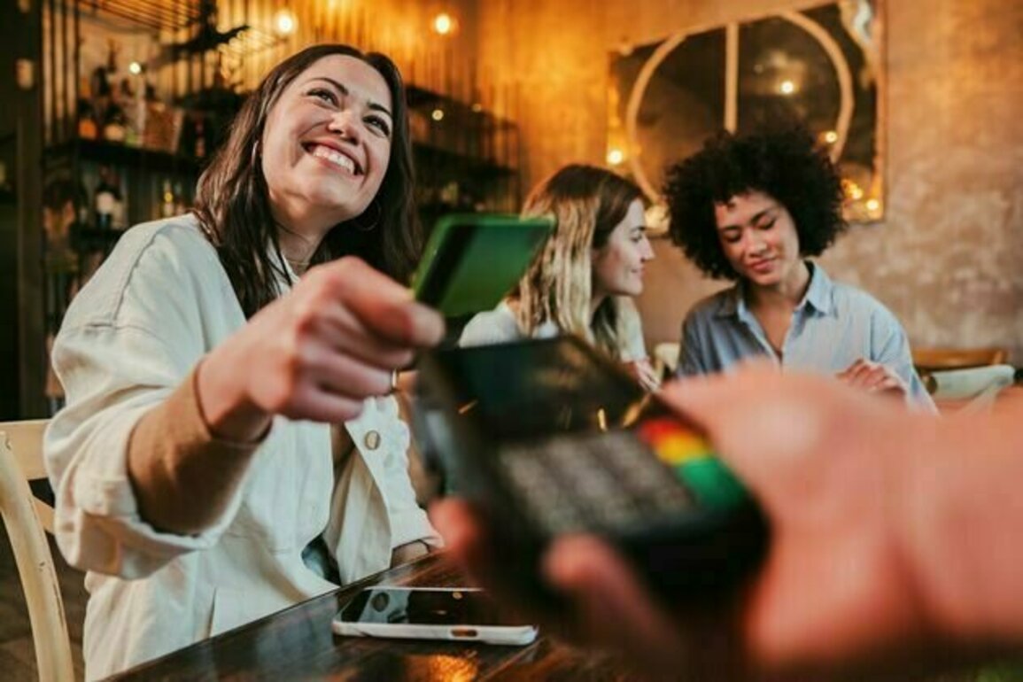 Time to ditch splitting the bill? Shouting a close friend could actually make you happier