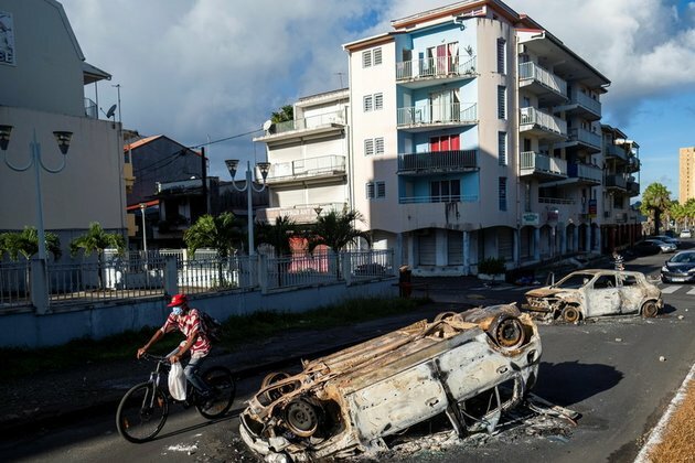 Arms depot looting amid Covid protests sparks demand for French help