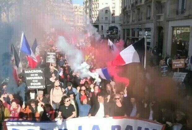 Thousands protest in Paris against Macrons defense policies 