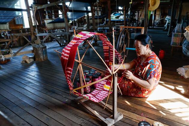 With patient hands, Myanmar's Inthas weave lotus fibers into world's handcrafted luxury