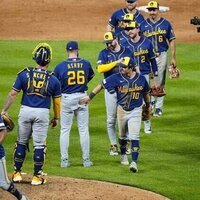 Stifled through 8, Brewers erupt late to sink Rockies in 10
