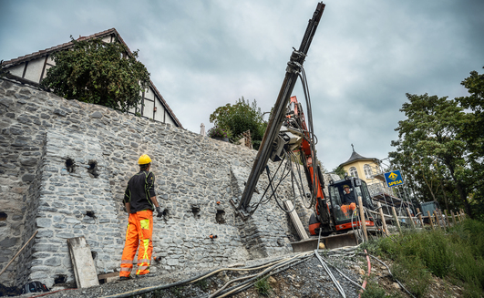 Injection boreholes and masonry nails were installed along with structural reinforcement using self-drilling anchors