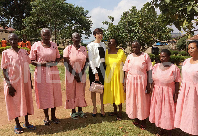  ome of the death row inmates pose for a picture with tephanie ivoal the rench mbassador