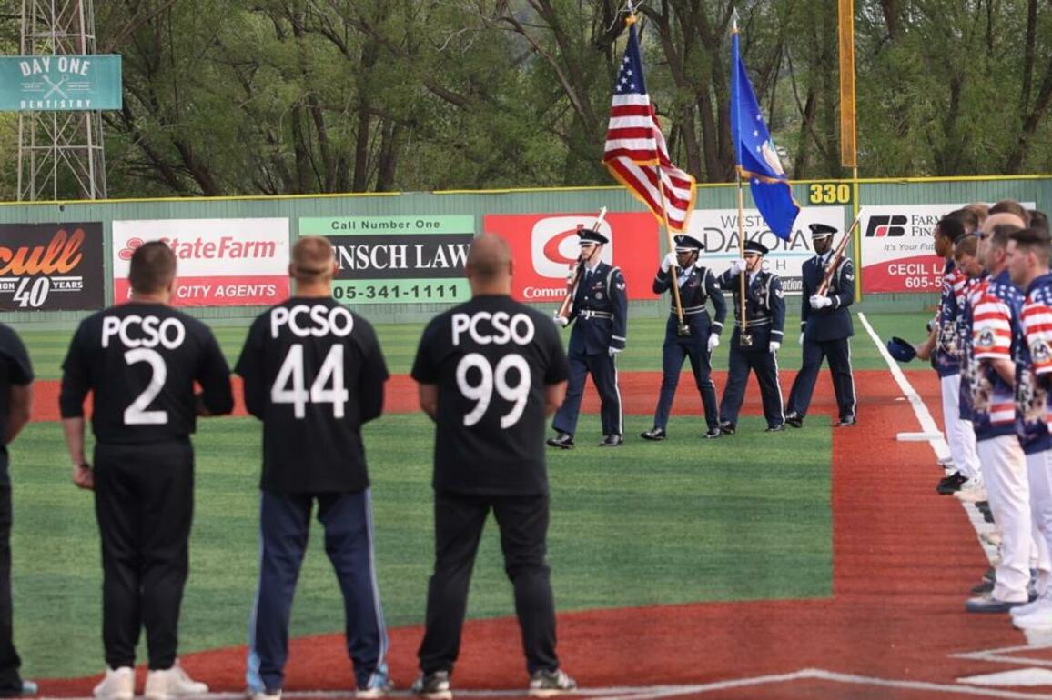 PHOTOS- Airmen win third annual National Police Week softball game