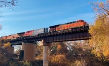 The FLXdrive battery-electric locomotive (second locomotive from the right) operating with two diesel locomotives in the US.