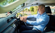  MinRes CEO mining services Mike Grey at the wheel of the electric ute